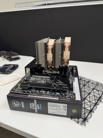 Motherboard bench-assembled with the Noctua NH-D15 G2 cooler and memory installed