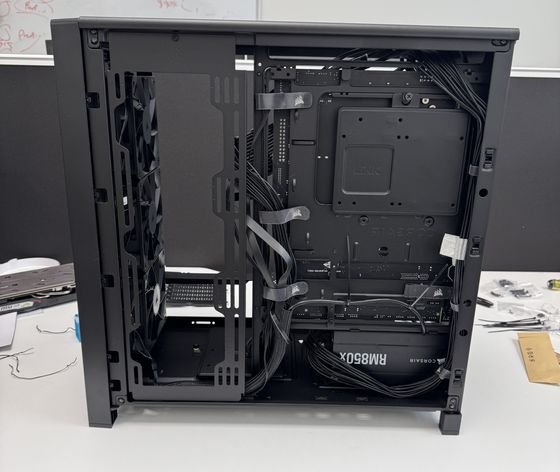 Rear of the case during cable management, power leads routed behind the motherboard tray